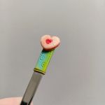 10. Čajová lžička dekorovaná lineckým cukrovím - vánoční téma - klasické slepované koláčky, srdíčka, kytičky